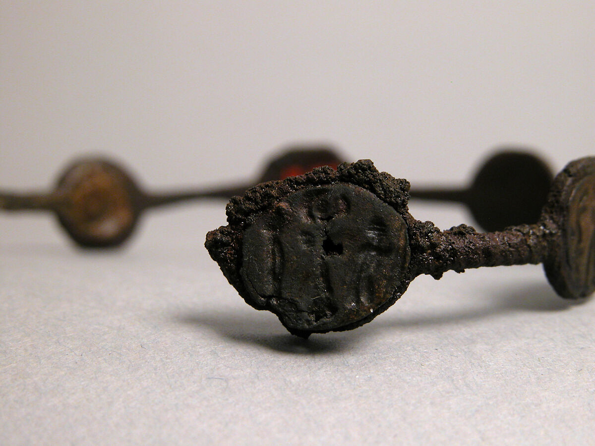 Bracelet, Iron; inlaid with bronze disks