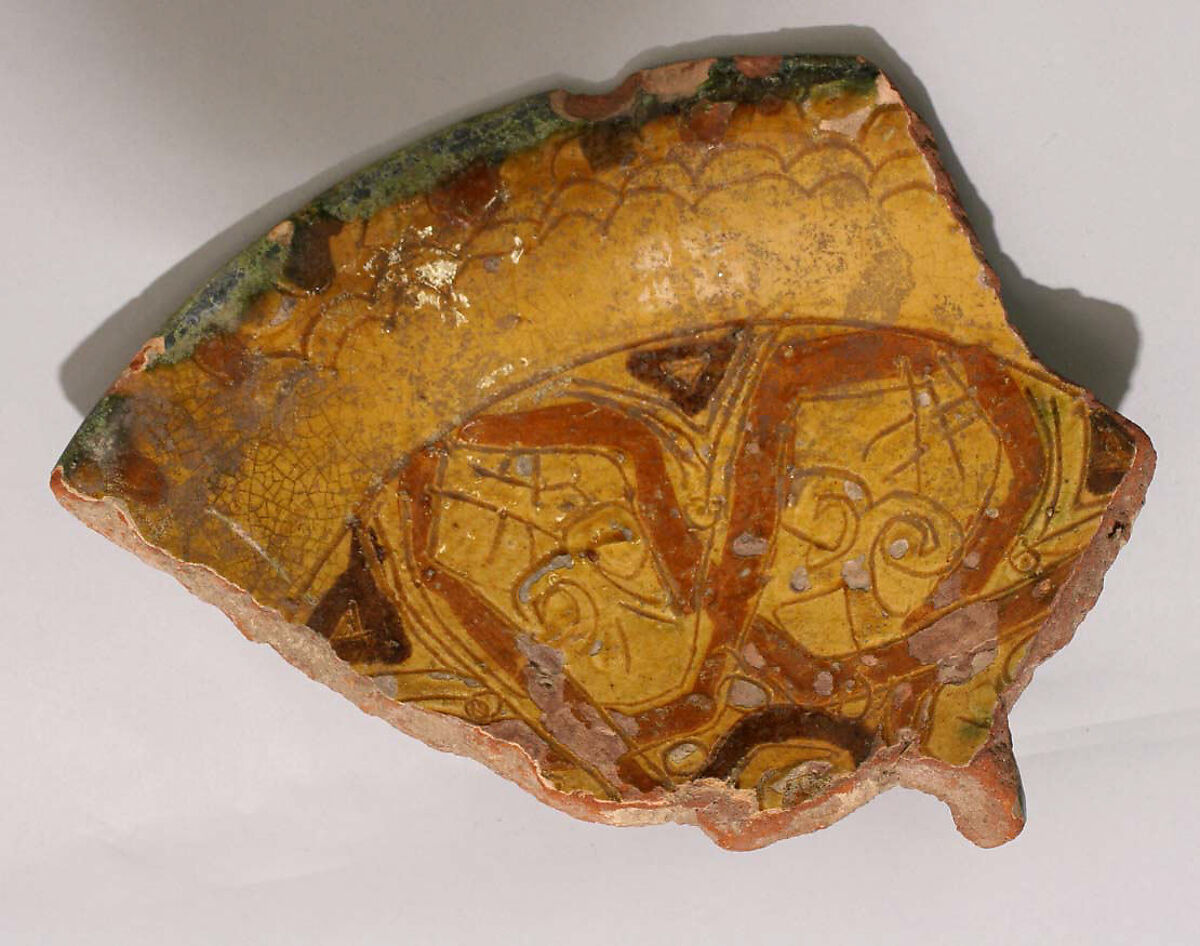 Fragment of a Bowl, Earthenware; incised and slip-painted under transparent glaze 