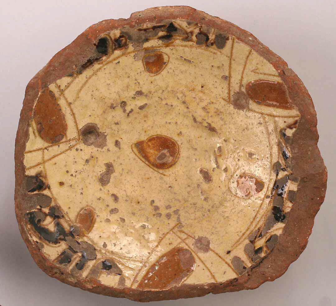 Fragment of a Bowl, Earthenware; incised decoration through white slip and coloring under transparent glaze 