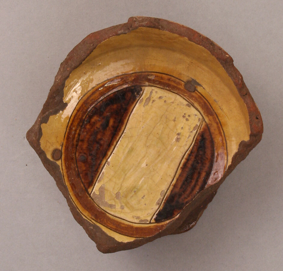 Fragment of a Bowl, Earthenware; incised decoration through white slip and coloring under transparent glaze 