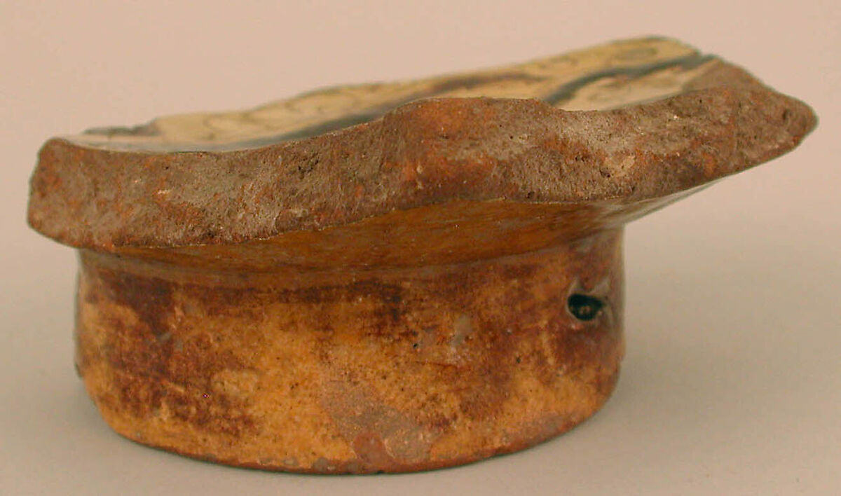 Fragment of a Bowl, Earthenware; incised decoration through white slip and coloring under transparent glaze.
