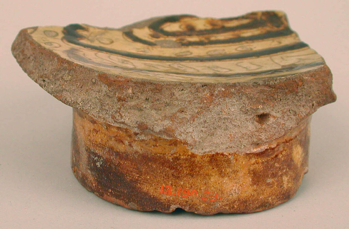 Fragment of a Bowl, Earthenware; incised decoration through white slip and coloring under transparent glaze.