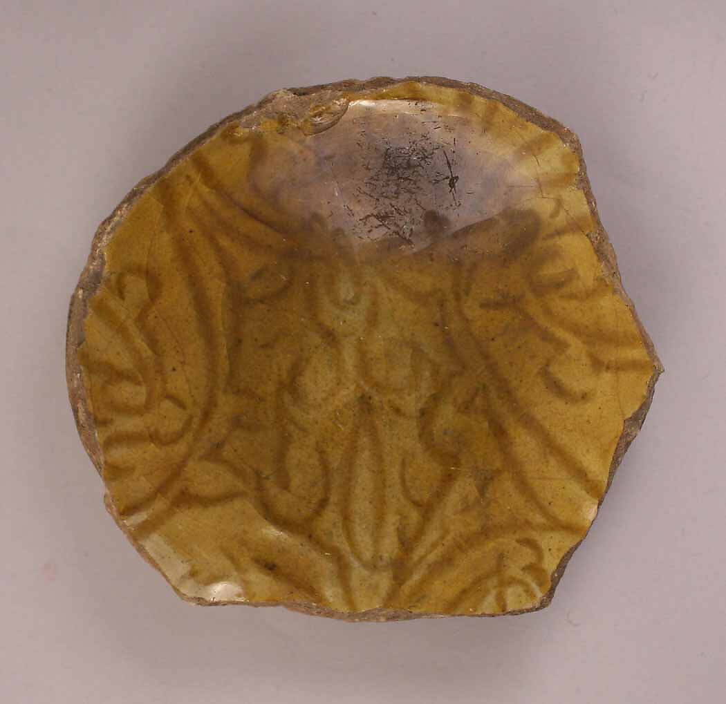 Fragment of a Dish, Earthenware; incised decoration under mustard yellow glaze 