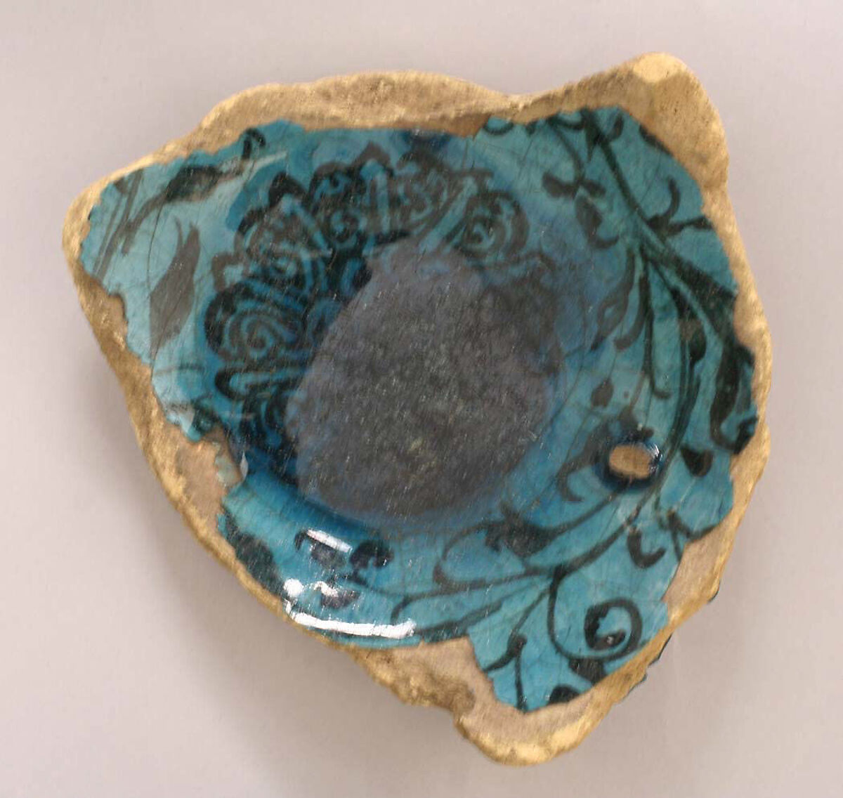 Fragment of a Bowl, Earthenware; underglaze painted under turquoise glaze 