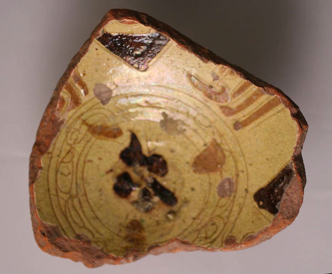 Fragment of a Bowl, Earthenware; incised decoration through white slip and coloring under transparent glaze 