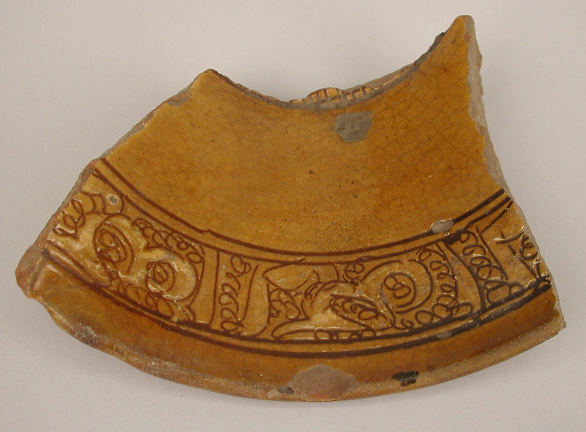Fragment of a Bowl, Earthenware; incised decoration through white slip and coloring under transparent glaze