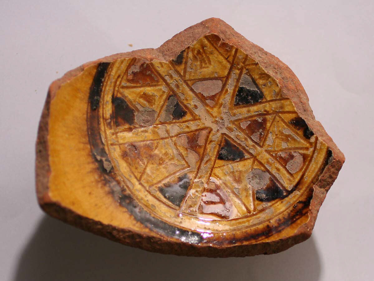 Fragment of a Bowl, Earthenware; incised decoration through white slip and coloring under transparent glaze 