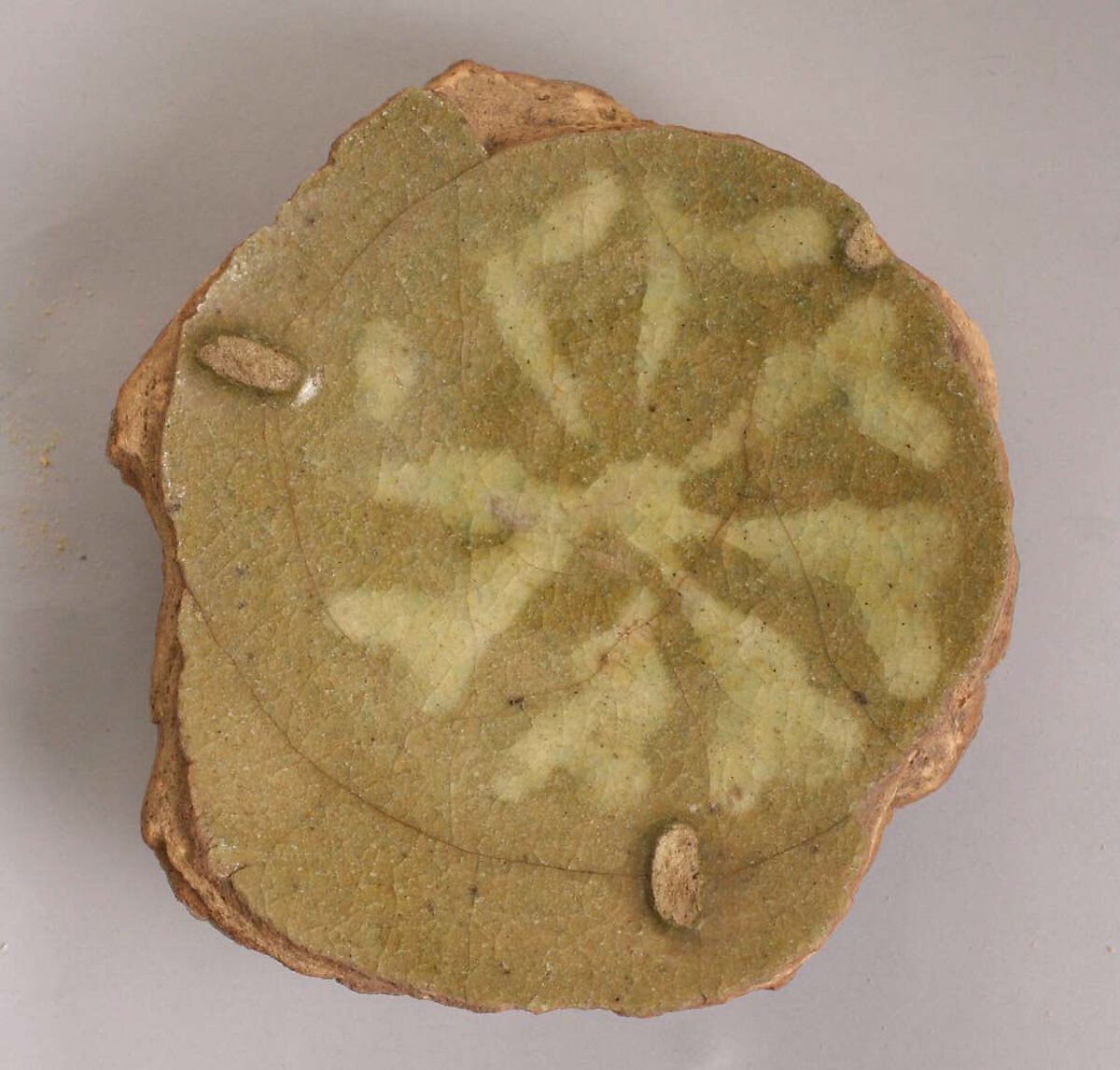Fragment of Dish, Stonepaste; slip-painted  under greenish glaze 