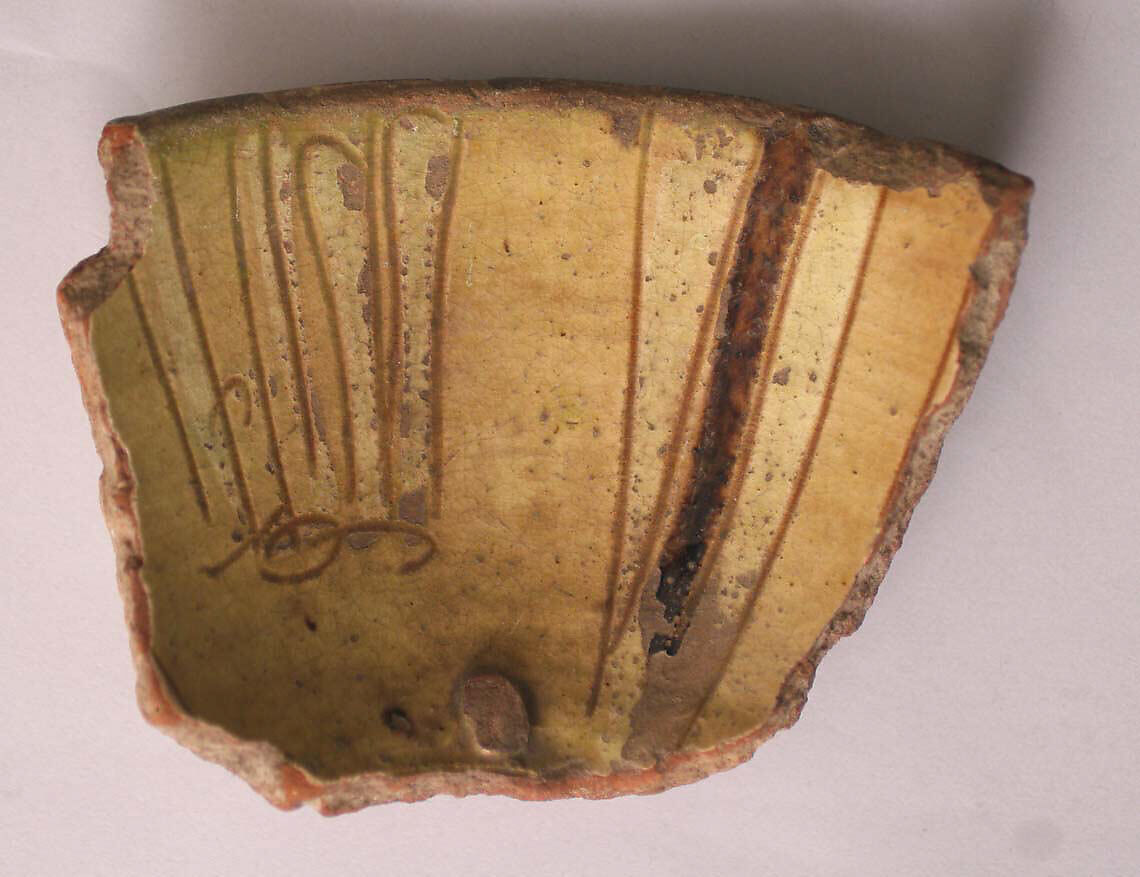 Fragment of a Bowl, Earthenware; incised decoration through white slip and coloring under transparent glaze. 