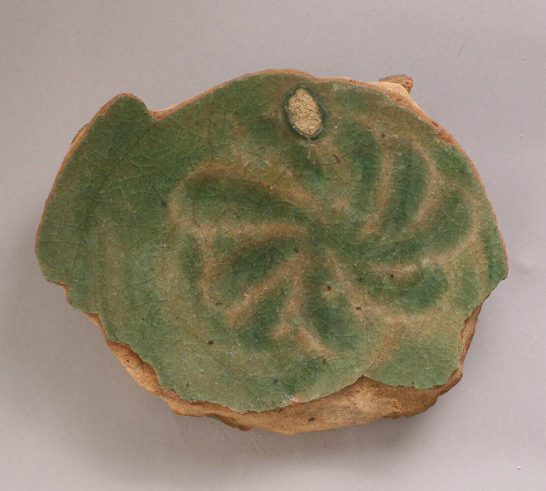 Fragment of a Bowl, Earthenware; modeled decoration under transparent green glaze 