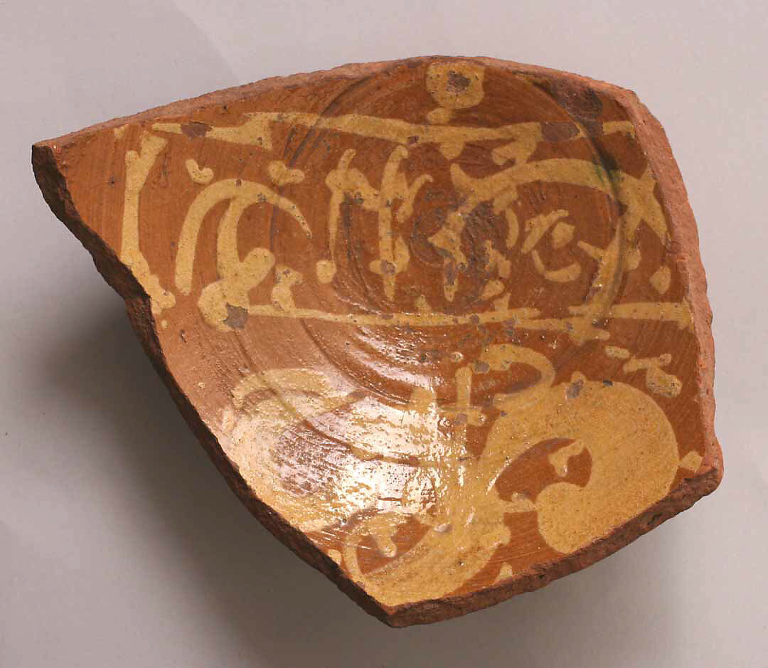 Fragment of a Bowl, Earthenware; slip-painted under transparent glaze 