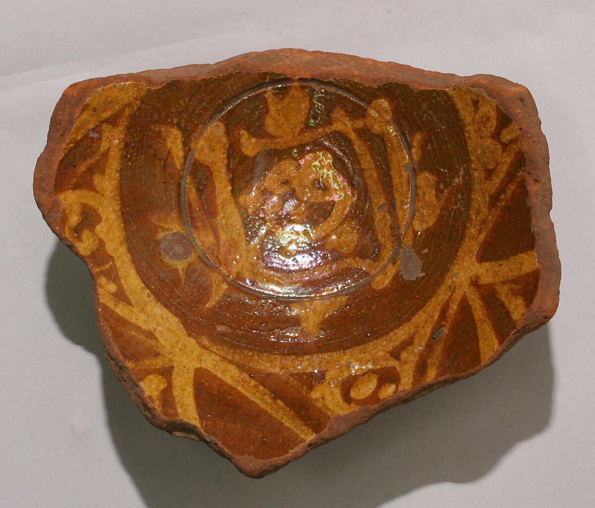 Fragment of a Bowl, Earthenware; slip-painted under transparent glaze 