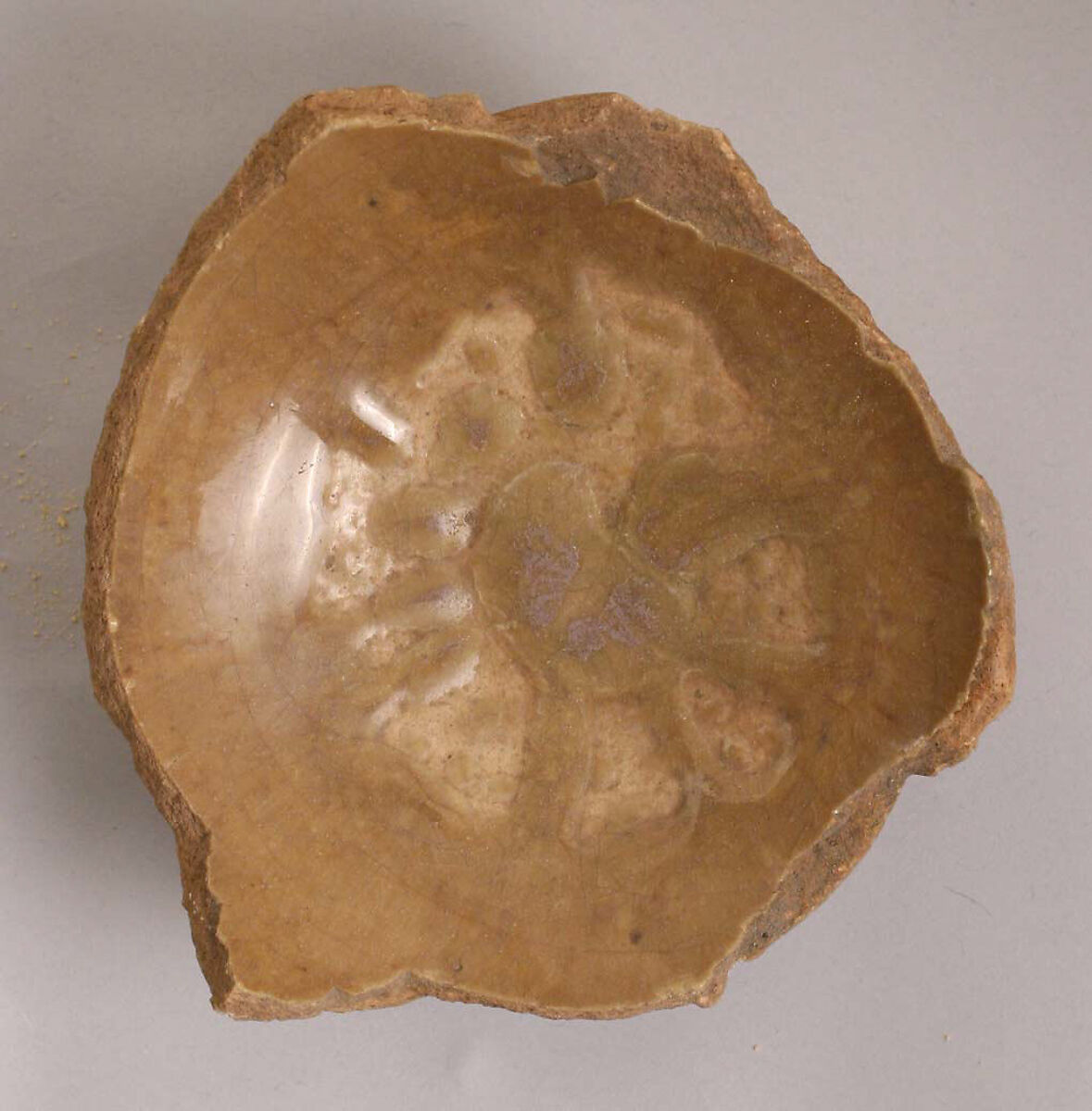 Fragment of a Bowl, Earthenware; slip-painted under yellowish glaze 