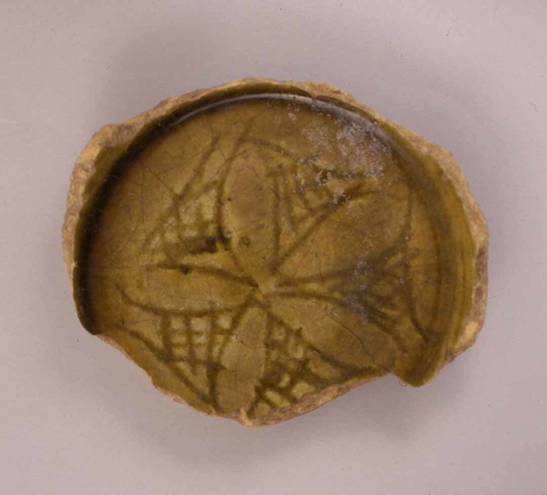 Fragment of a Dish, Earthenware; incised decoration under olive green glaze 