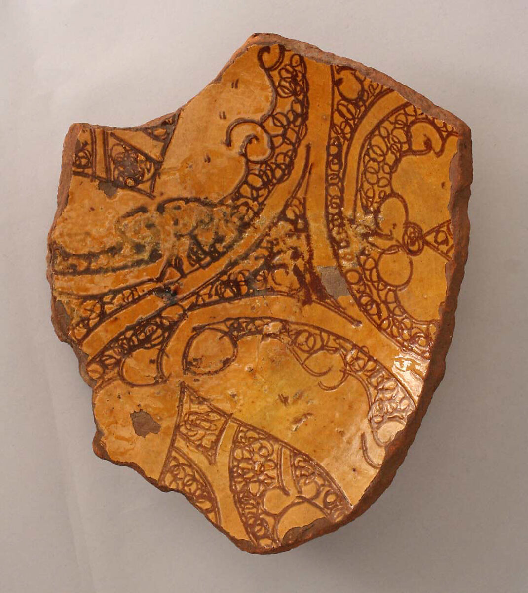 Ceramic Fragment, Earthenware; incised decoration through a white slip and coloring under a transparent glaze. 