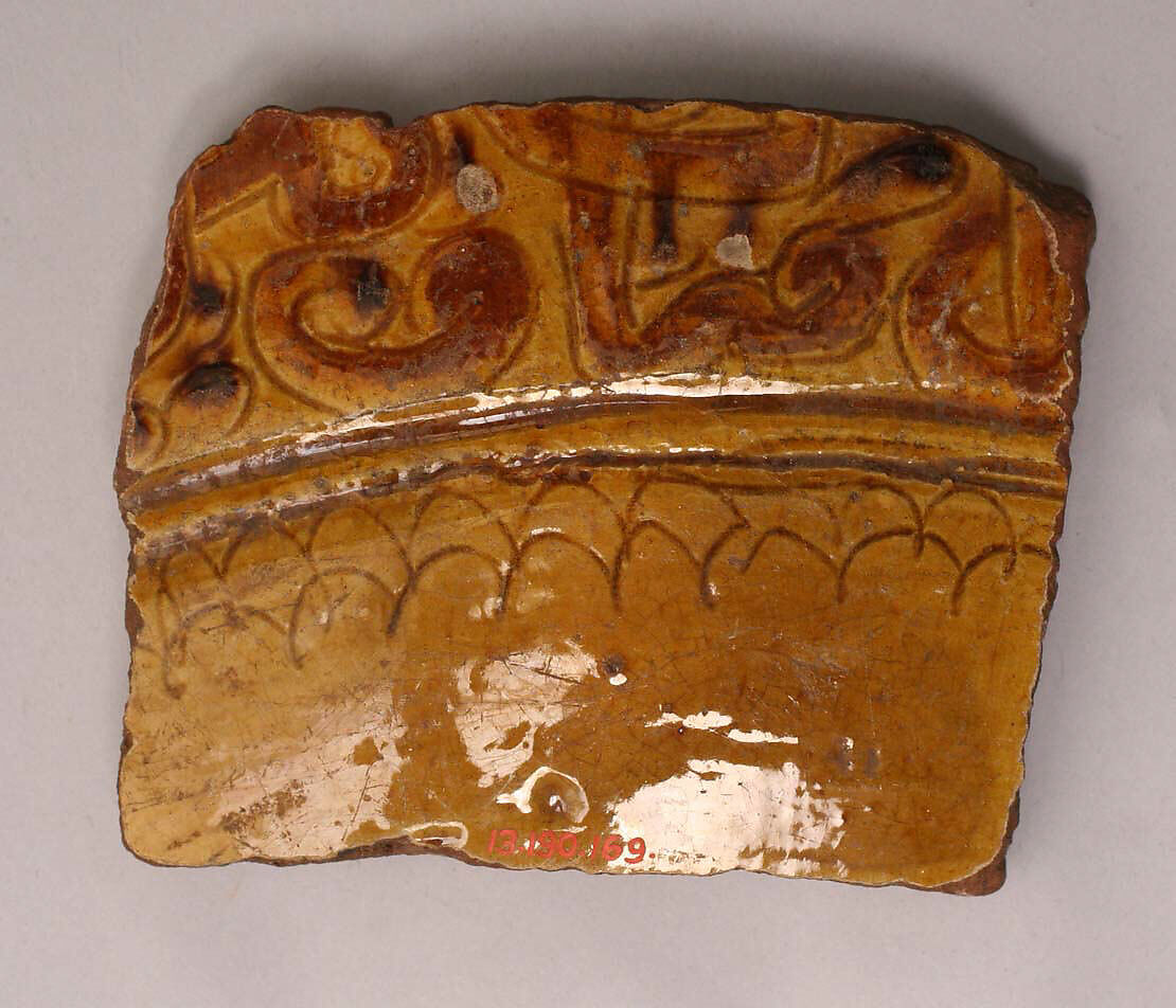 Ceramic fragment, Earthenware; incised decoration through white slip and coloring under transparent glaze. 