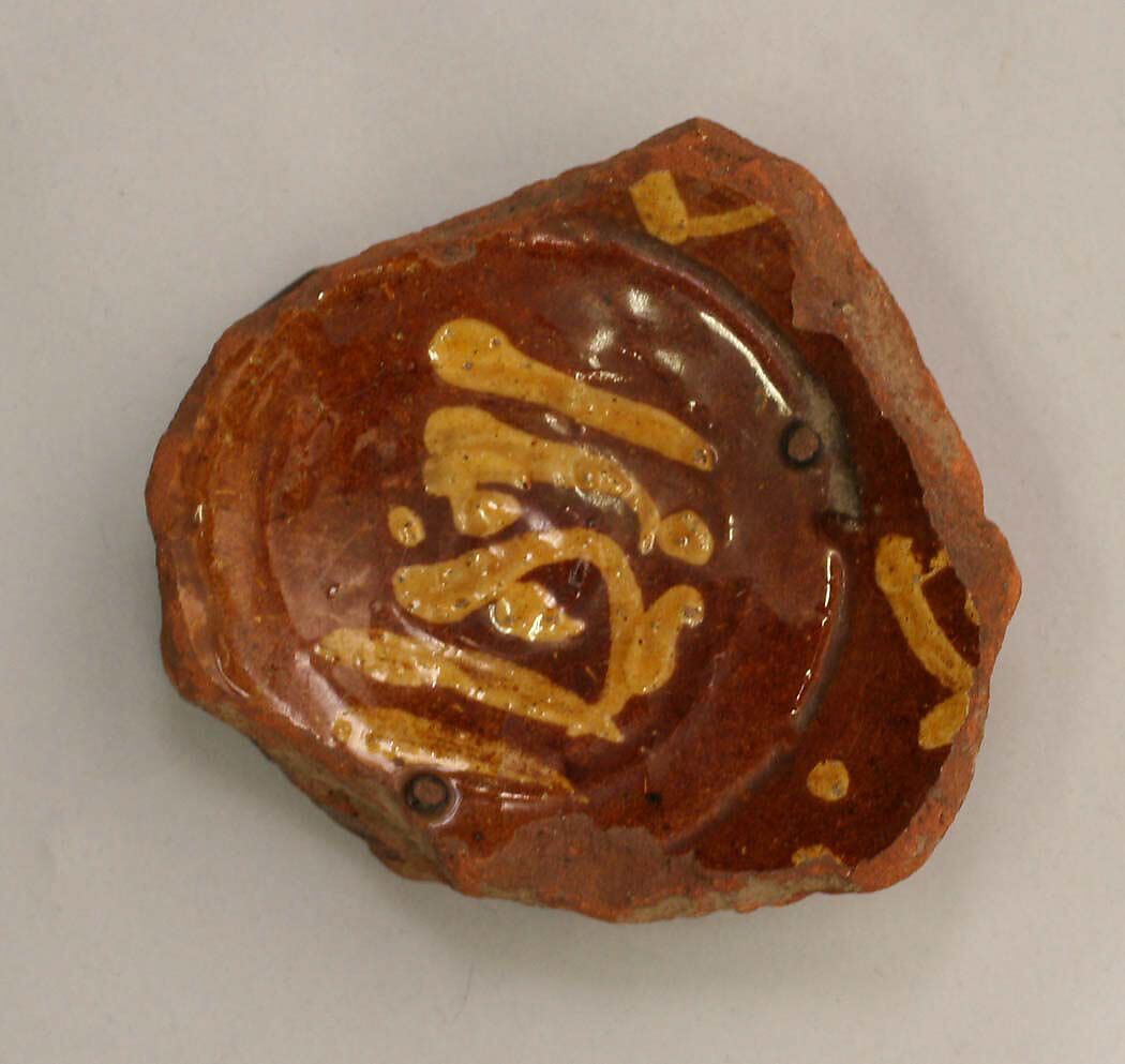 Fragment of a Bowl, Earthenware; slip-painted under transparent glaze 