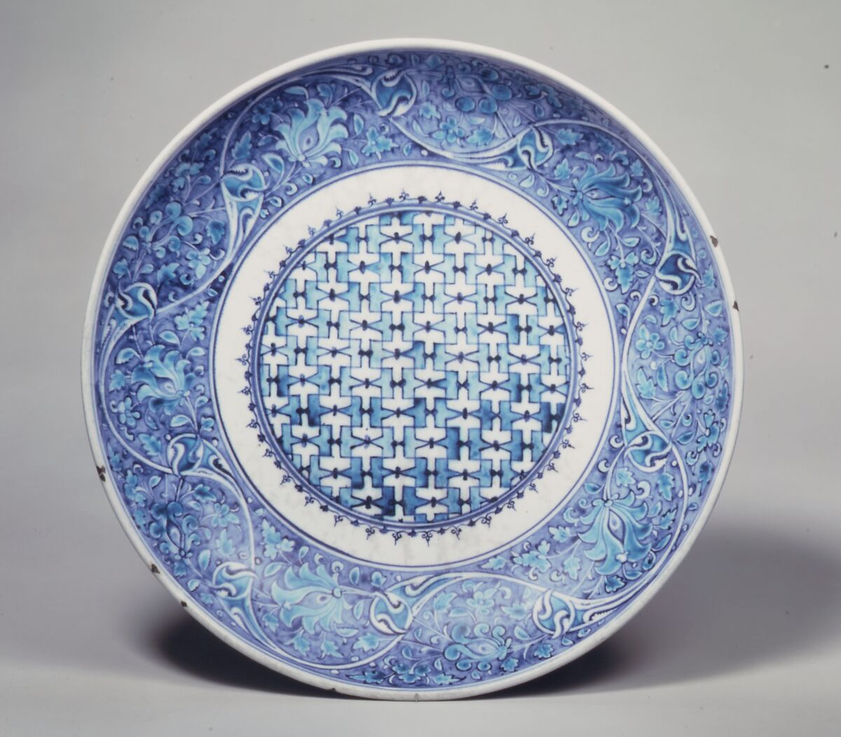 Dish, Stonepaste; painted in turquoise and two hues of blue under transparent glaze