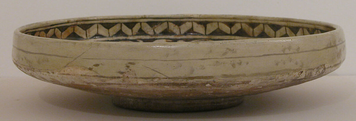 Dish with a Horseman and Trained Cheetah, Earthenware; slipped and carved under transparent colorless-brown glaze