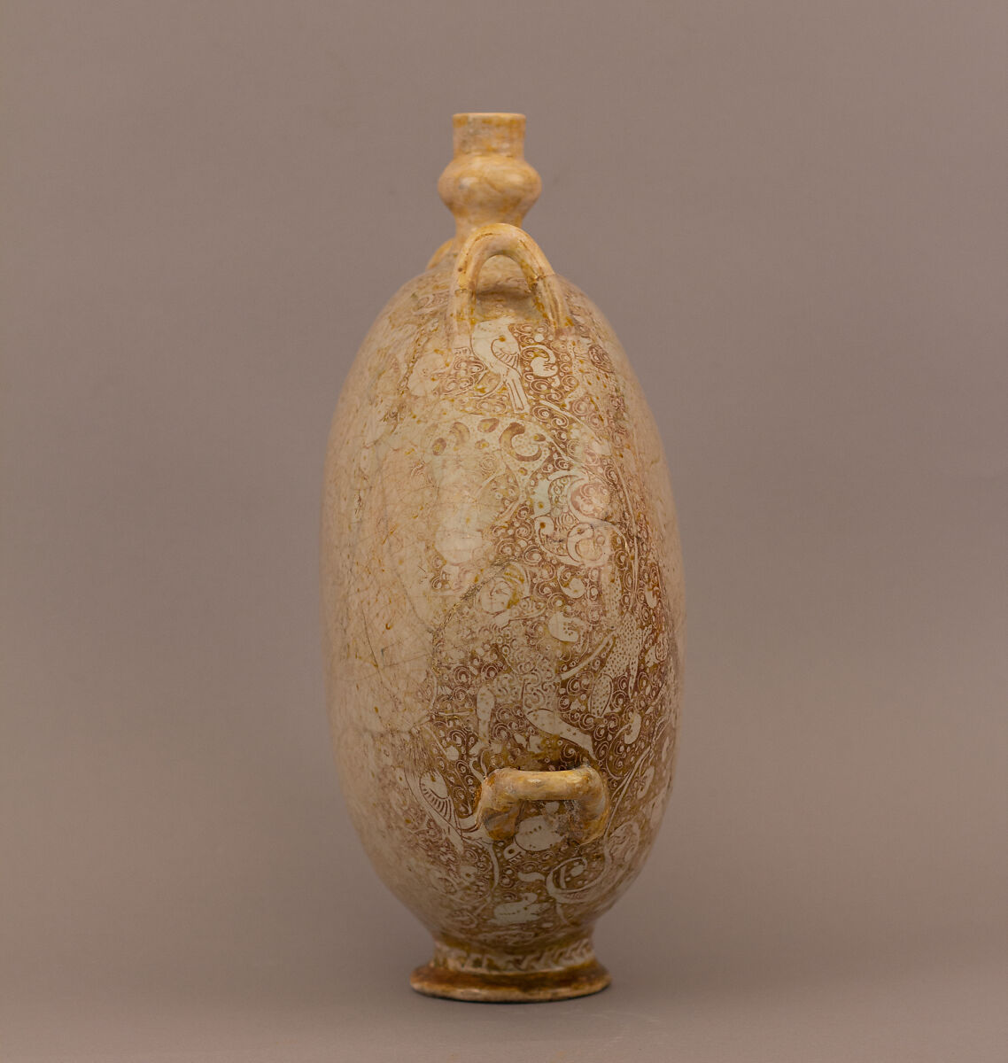 Flask with Harpies, Animals, and Human Figures in Lush Vegetation and a Pond, Stonepaste; molded, luster-painted over opaque white glaze