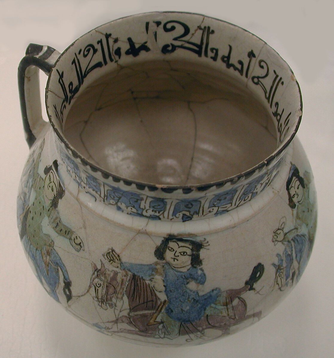 Ewer with Horsemen Inscribed in Arabic with Good Wishes to its Owner, Stonepaste; polychrome inglaze and overglaze painted on opaque monochrome glaze (mina'i)