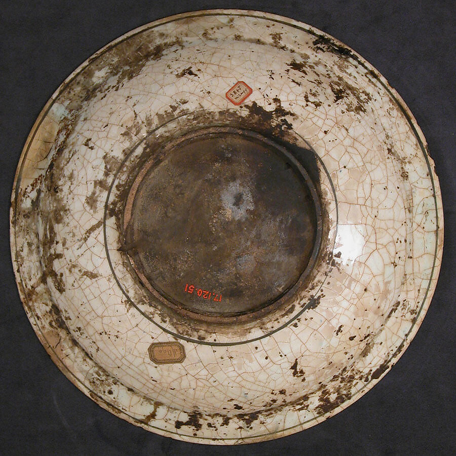 Dish, Stonepaste; underglaze painted in black, blue, and green with red and yellow slips
