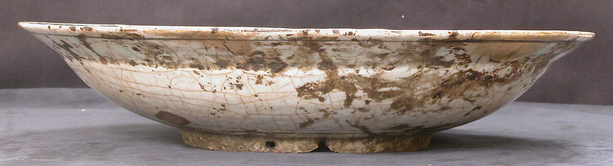 Dish, Stonepaste; underglaze painted in black, blue, and green with red and yellow slips