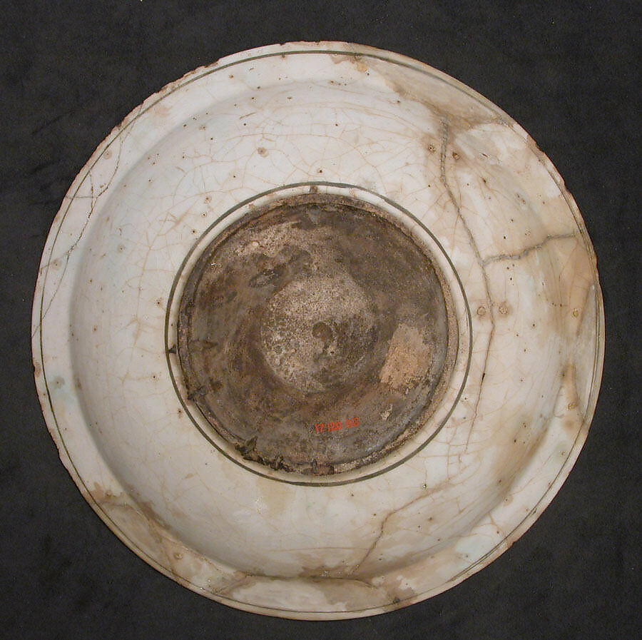 Dish, Stonepaste; underglaze painted in black, blue, and green with red and yellow slips