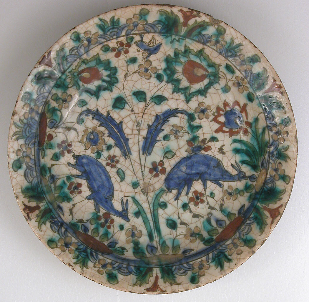 Dish, Stonepaste; underglaze painted in black, blue, and green with red and yellow slips 