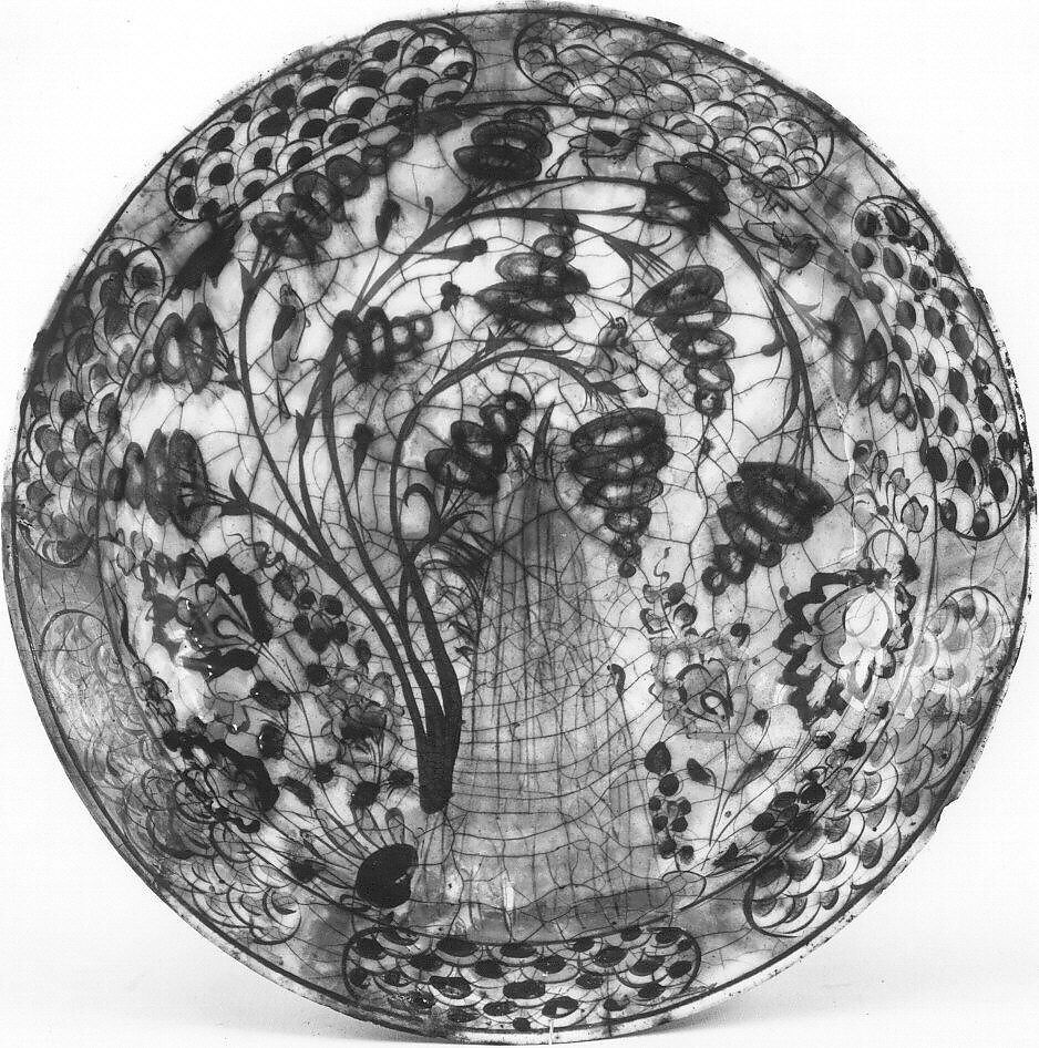 Dish, Stonepaste; underglaze painted in black, blue, and green with red and yellow slips