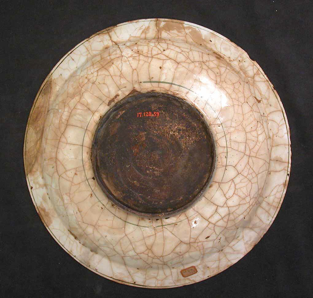 Dish, Stonepaste; underglaze painted in black, blue, and green with red and yellow slips