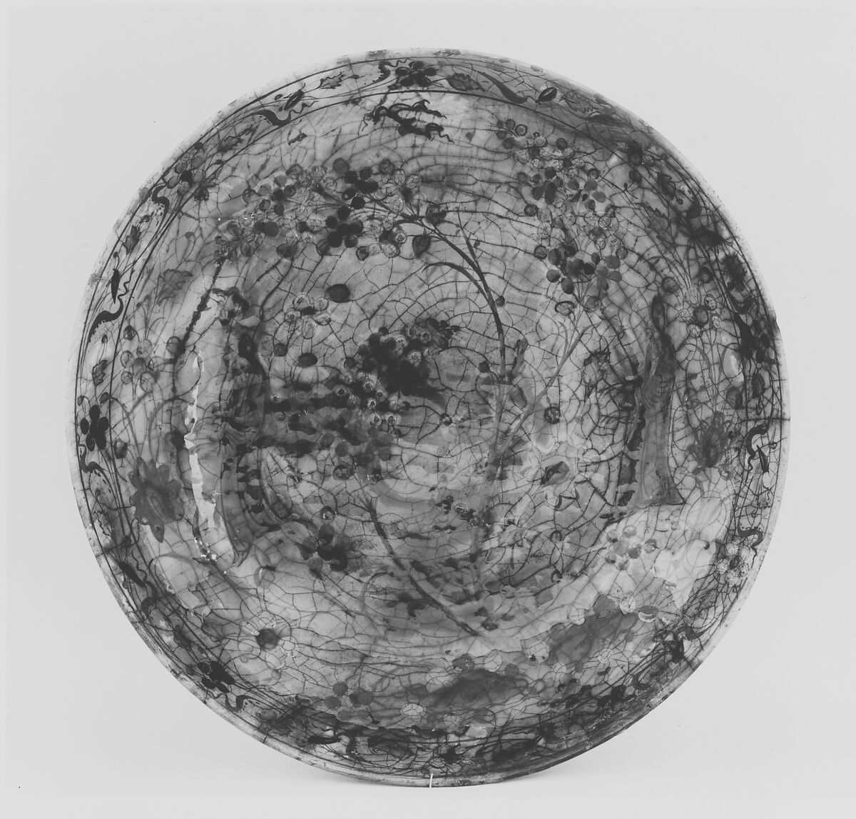 Dish, Stonepaste; underglaze painted in black, blue, and green with red and yellow slips