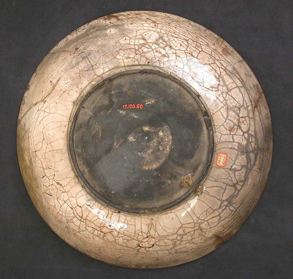 Dish, Stonepaste; underglaze painted in black, blue, and green with red and yellow slips