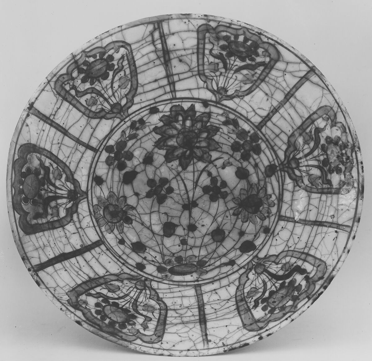 Dish, Stonepaste; underglaze painted in black, blue, and green with red and yellow slips