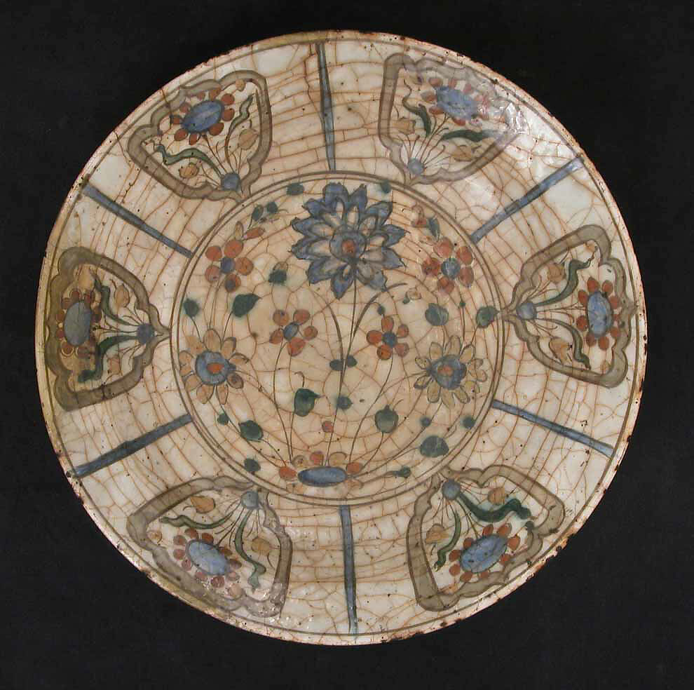 Dish, Stonepaste; underglaze painted in black, blue, and green with red and yellow slips 