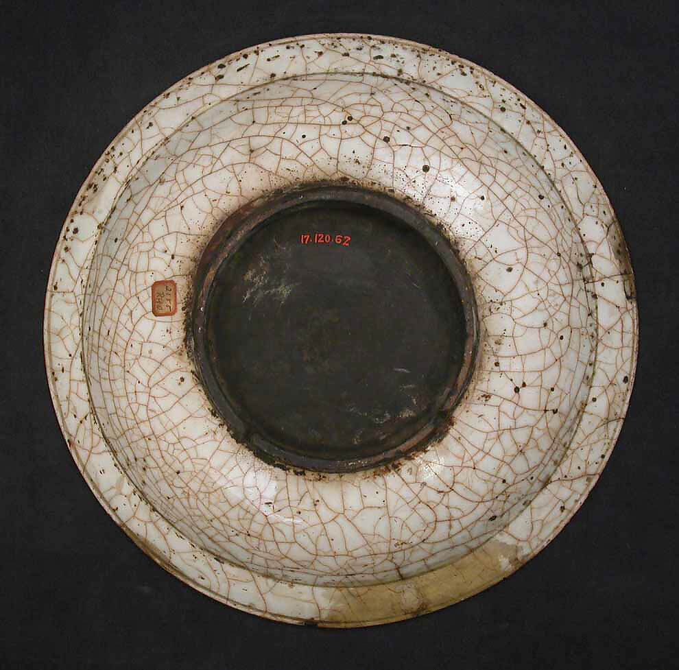 Dish, Stonepaste; underglaze painted in black, blue, and green with red and yellow slips