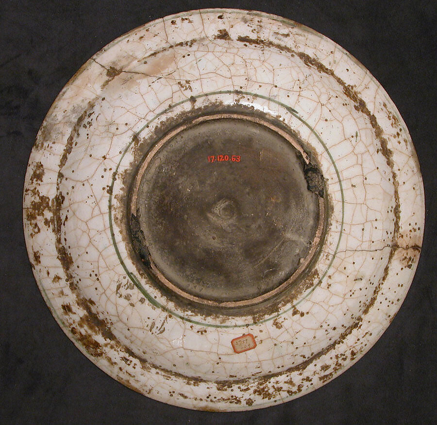 Dish, Stonepaste; underglaze painted in black, blue, and green with red and yellow slips
