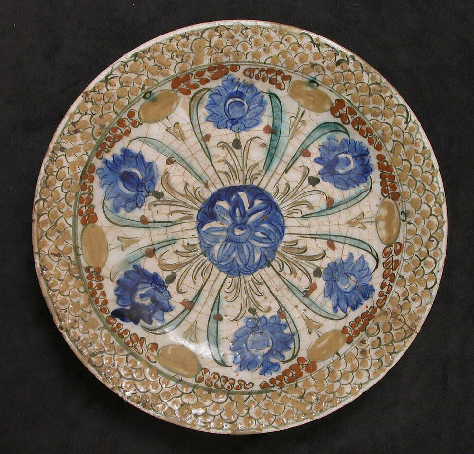 Dish, Stonepaste; underglaze painted in black, blue, and green with red and yellow slips 