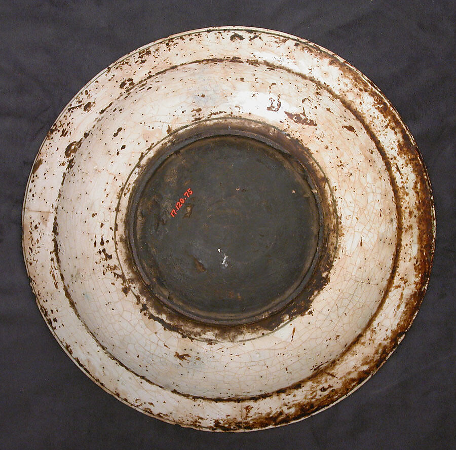 Dish, Stonepaste; underglaze painted in black, blue, and green with red and yellow slips