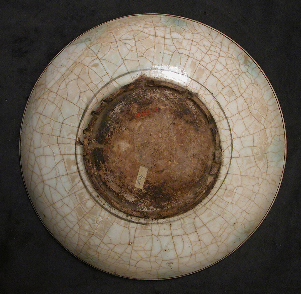 Dish, Stonepaste; underglaze painted in black, blue, and green with red and yellow slips