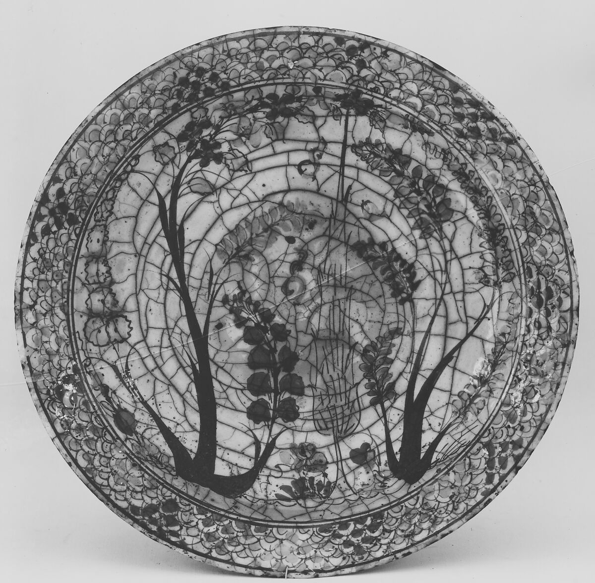 Dish, Stonepaste; underglaze painted in black, blue, and green with red and yellow slips