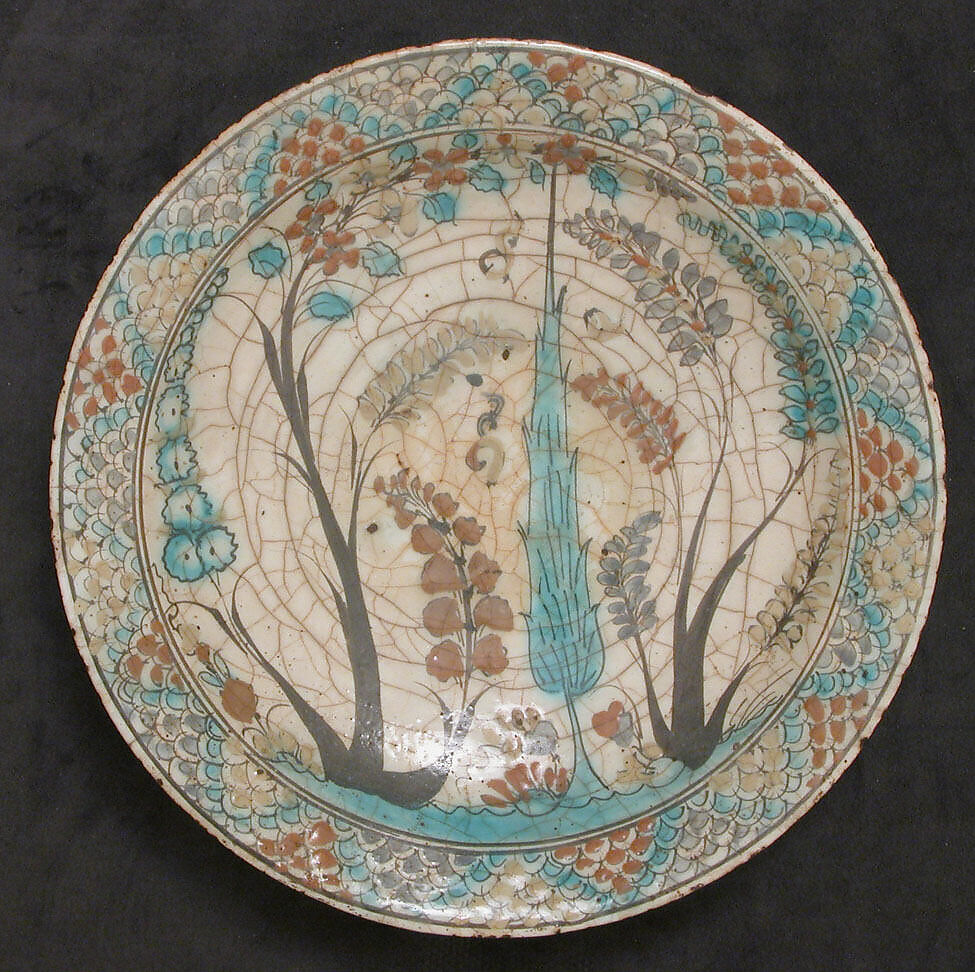 Dish, Stonepaste; underglaze painted in black, blue, and green with red and yellow slips 