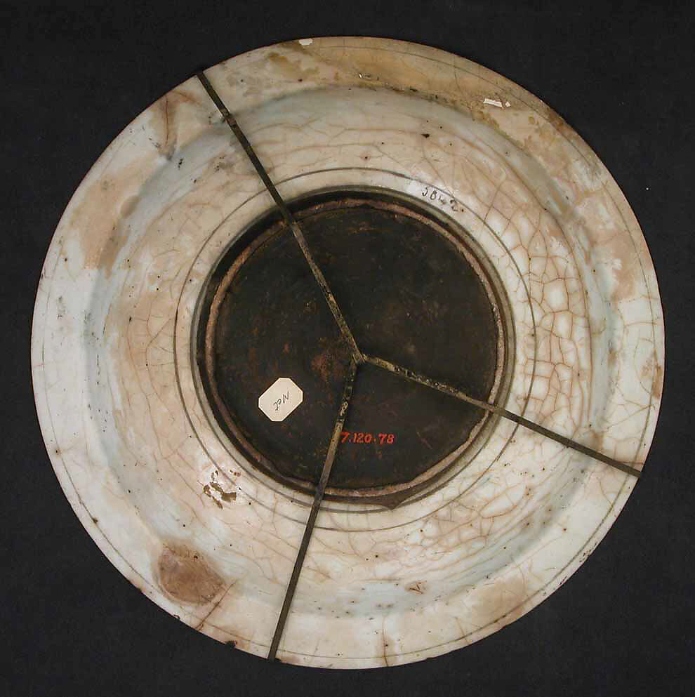 Dish, Stonepaste; underglaze painted in black, blue, and green with red and yellow slips