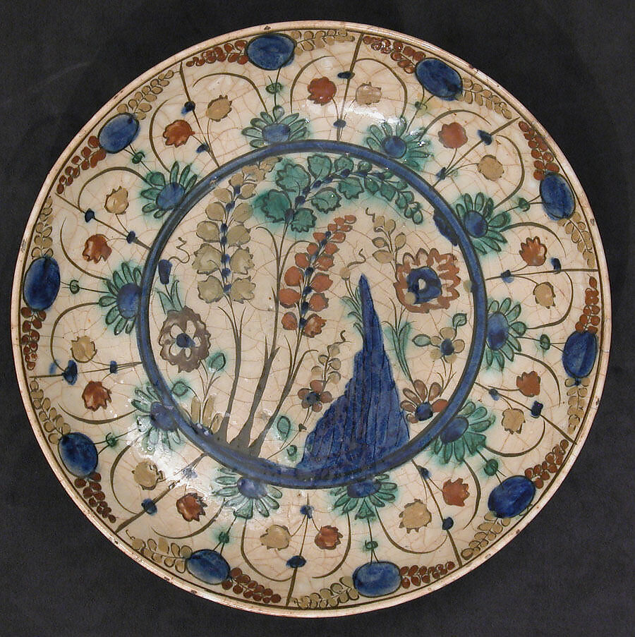 Dish, Stonepaste; underglaze painted in black, blue, and green with red and yellow slips 