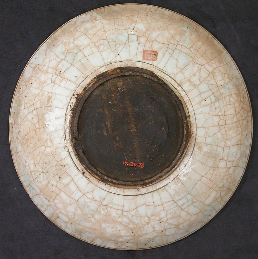 Dish, Stonepaste; underglaze painted in black, blue, and green with red and yellow slips
