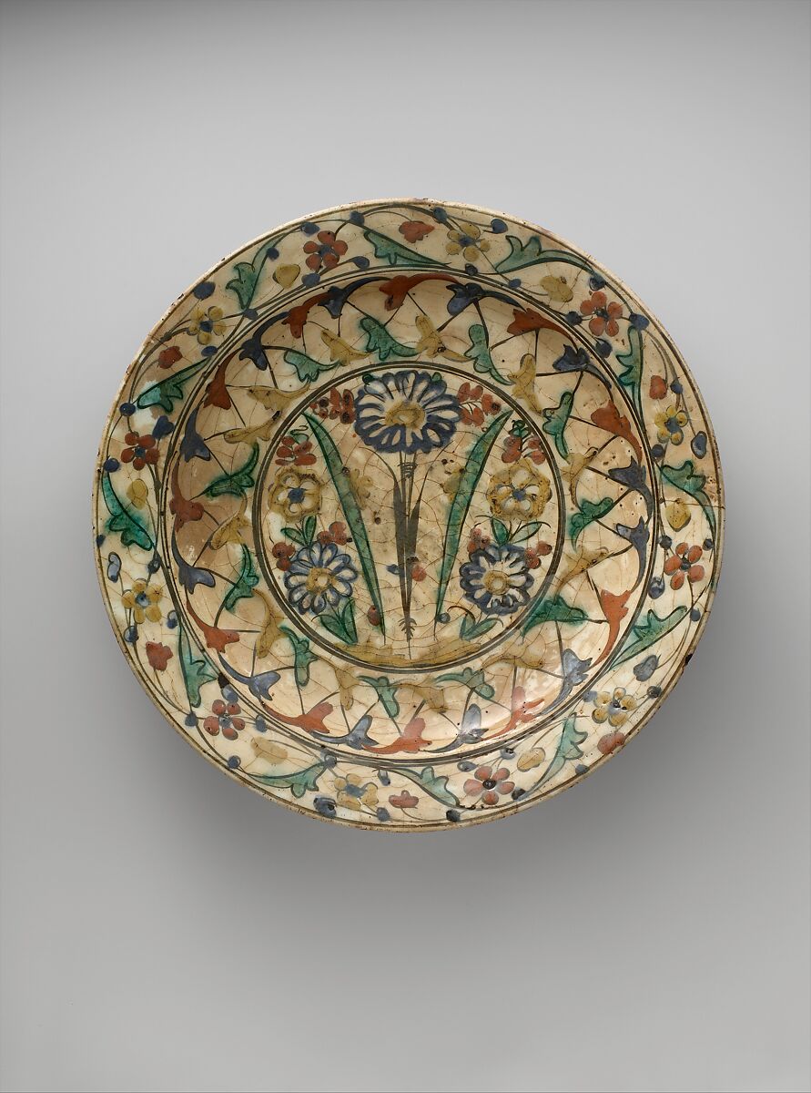 Dish, Stonepaste; underglaze painted in black, blue, and green with red and yellow slips