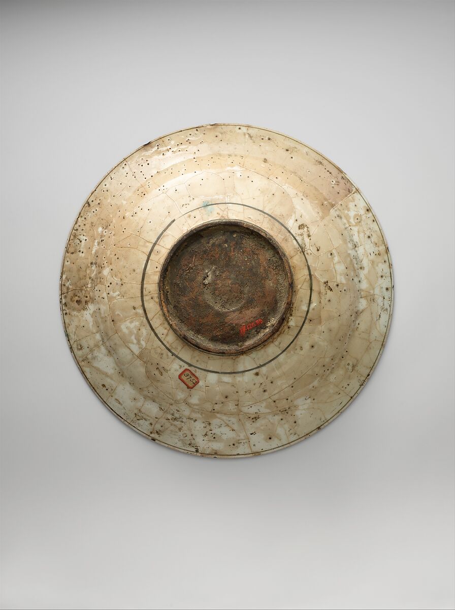 Dish, Stonepaste; underglaze painted in black, blue, and green with red and yellow slips