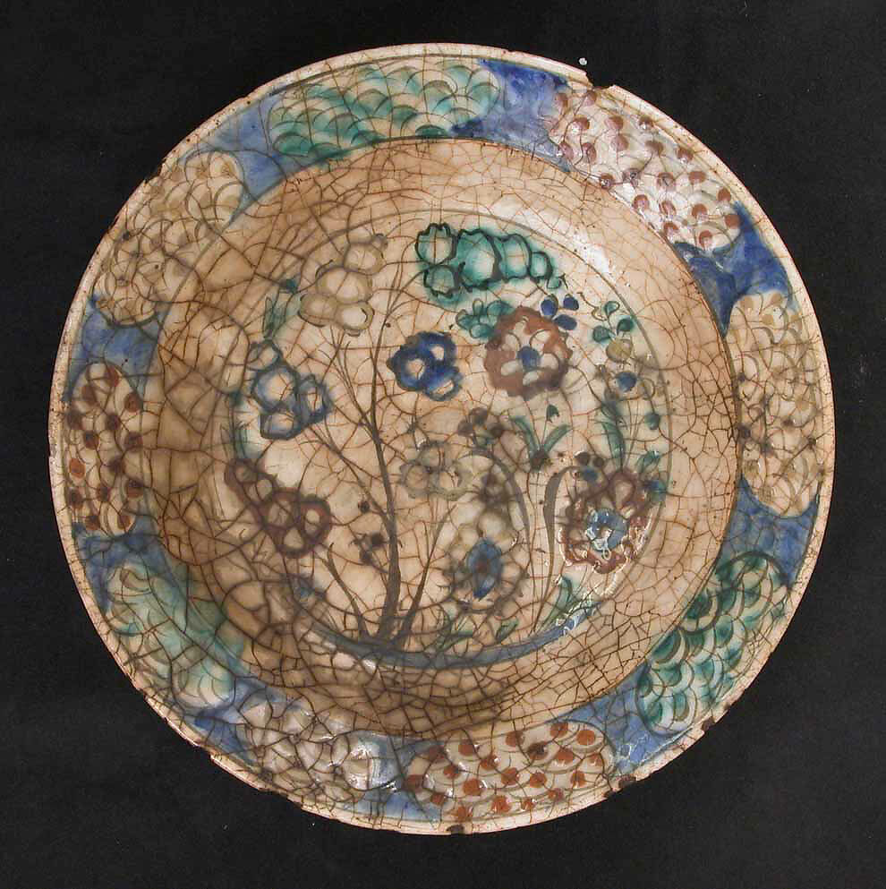 Dish, Stonepaste; underglaze painted in black, blue, and green with red and yellow slips 