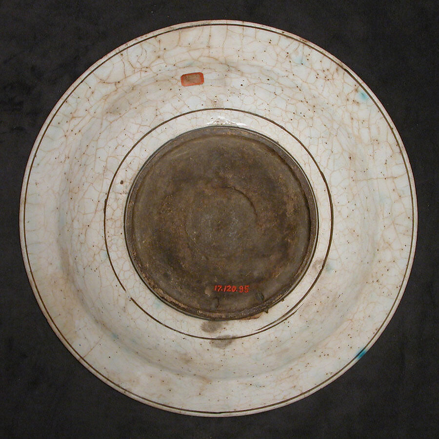 Dish, Stonepaste; underglaze painted in black, blue, and green with red and yellow slips