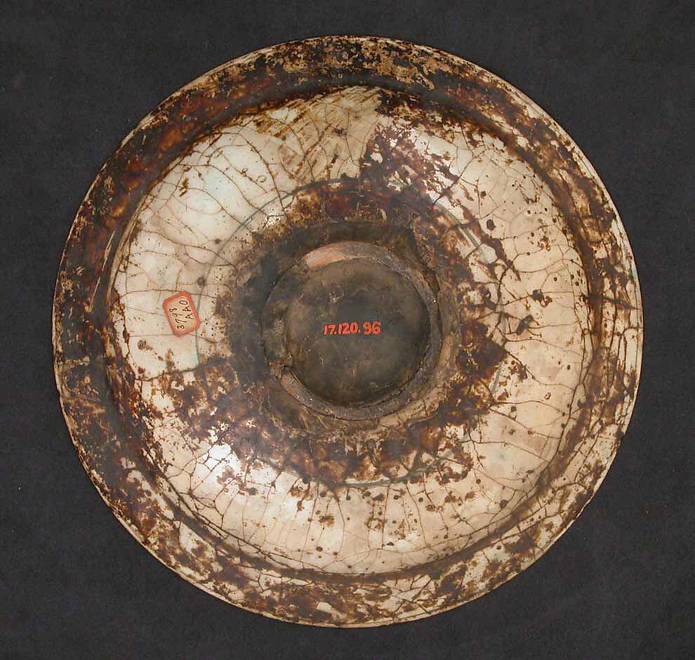 Dish, Stonepaste; underglaze painted in black, blue, and green with red and yellow slips